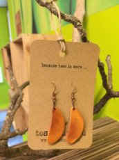 Handmade earrings from peach wood.