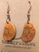 Handmade earrings made of chestnut wood.