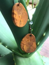 Handmade earrings from beech wood finished with a natural layer.